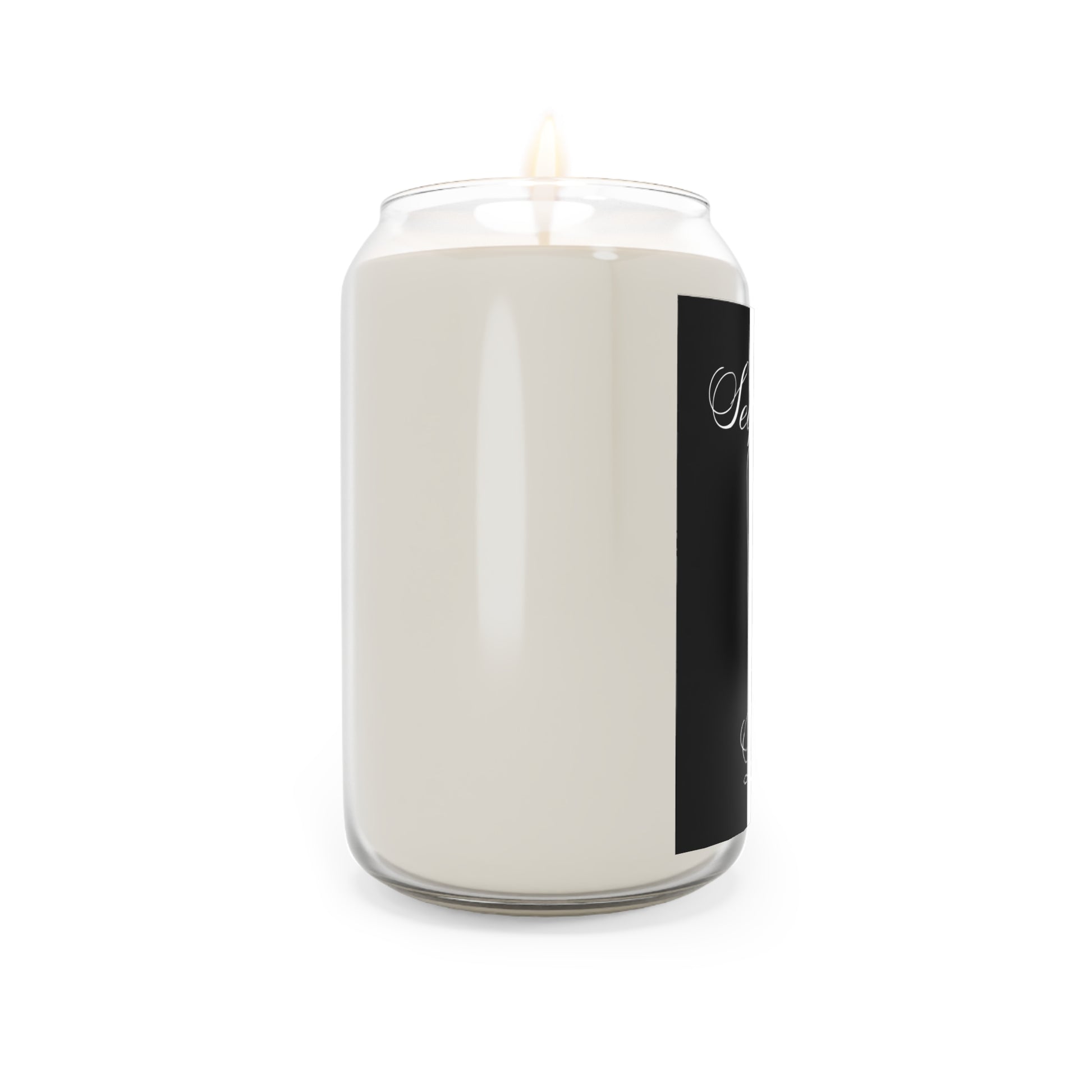 White candle in a glass jar with a black label on a white background
