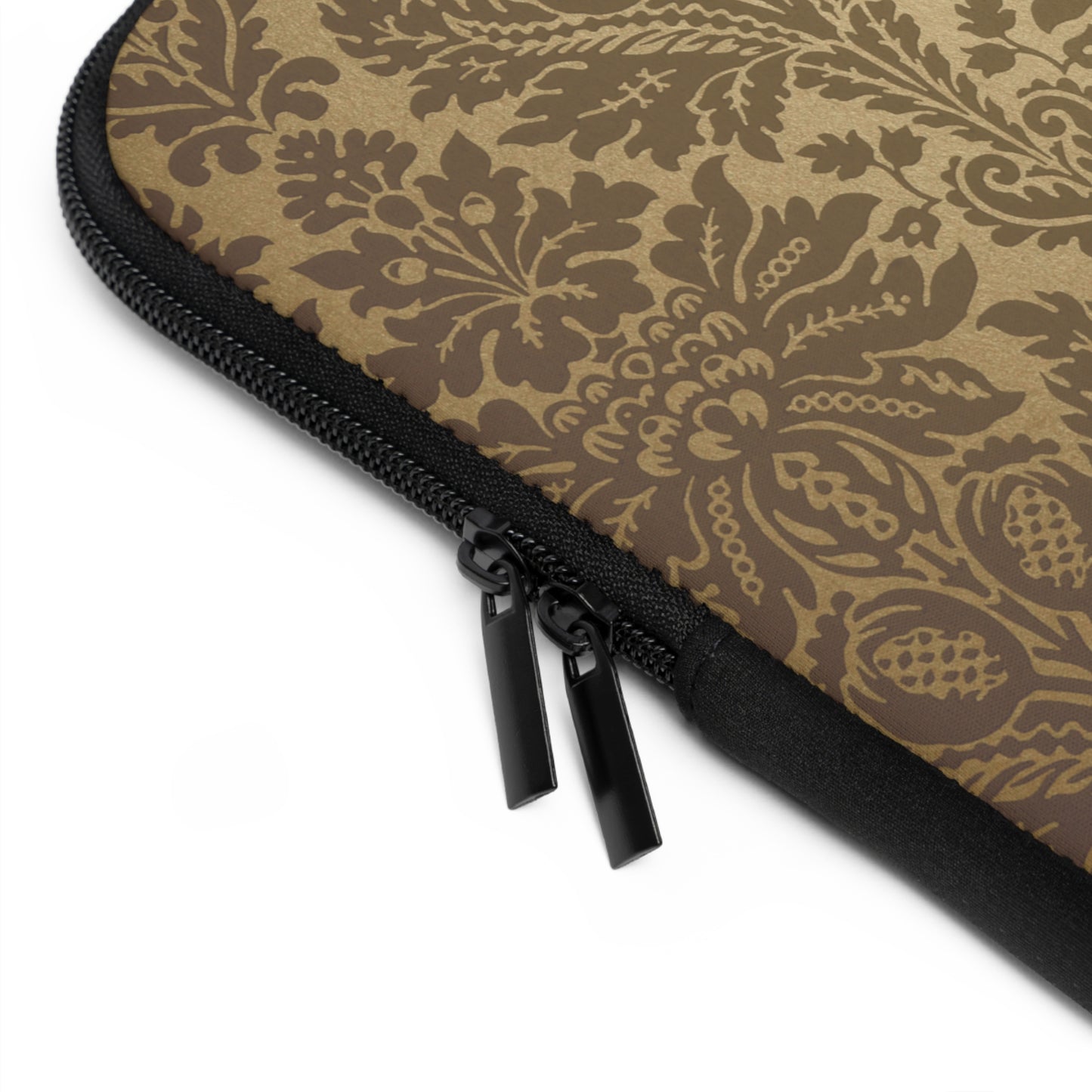 Close-up of a brown floral patterned pouch with a black zipper on a white background