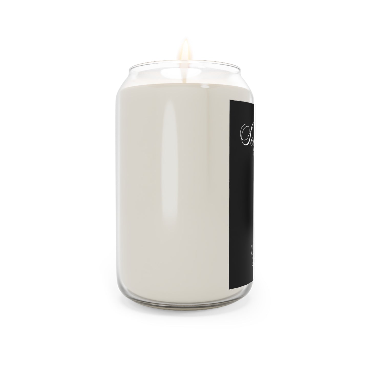 White candle in a glass jar with a black label on a white background