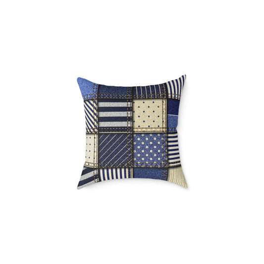 Patchwork-style pillow with blue, beige, and white patterns on a white background