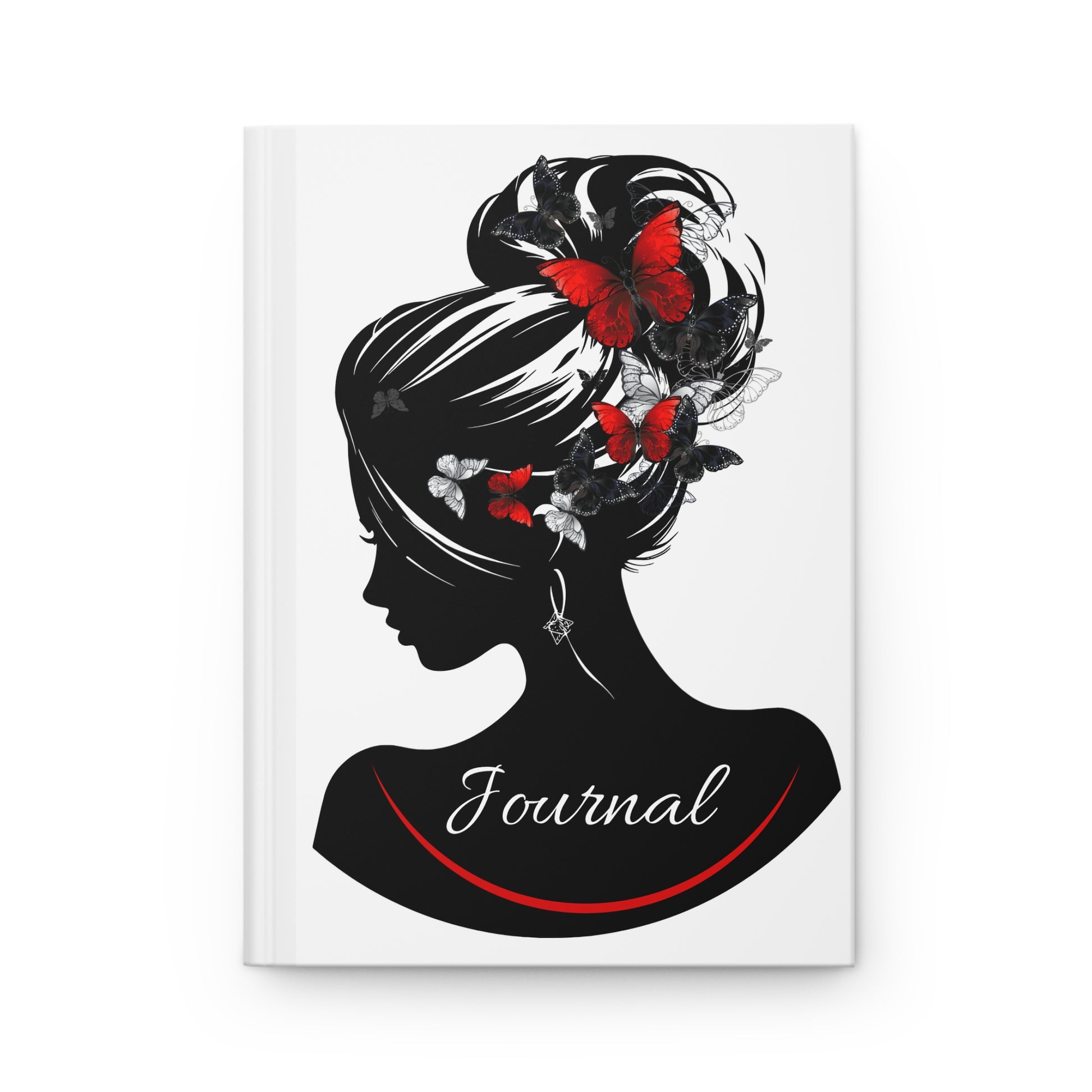 Journal cover with a black and white silhouette of a woman's head with butterflies and flowers, on a white background.