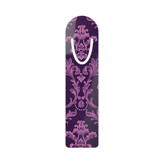 Decorative purple and pink patterned object with a handle on a white background