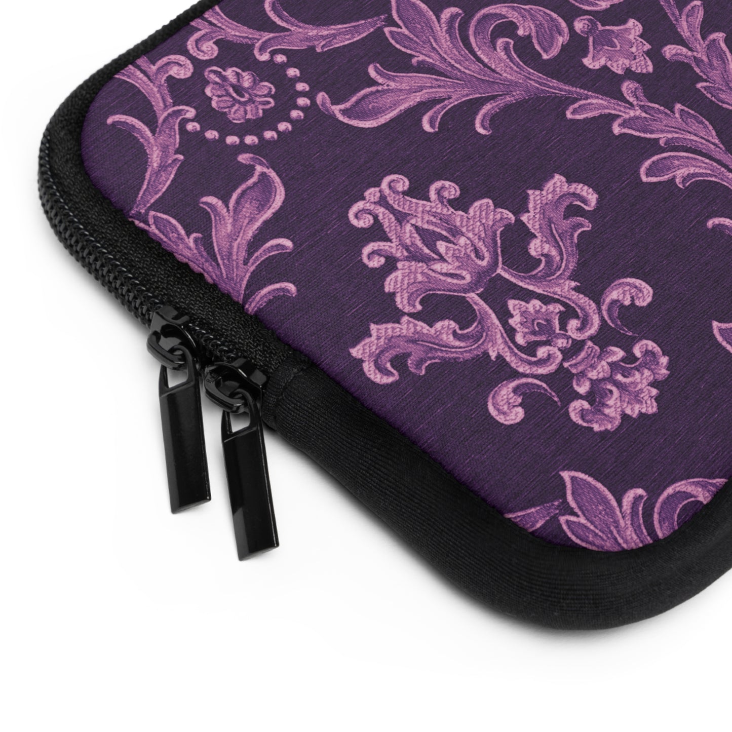 Purple patterned pouch with black zipper on a white background