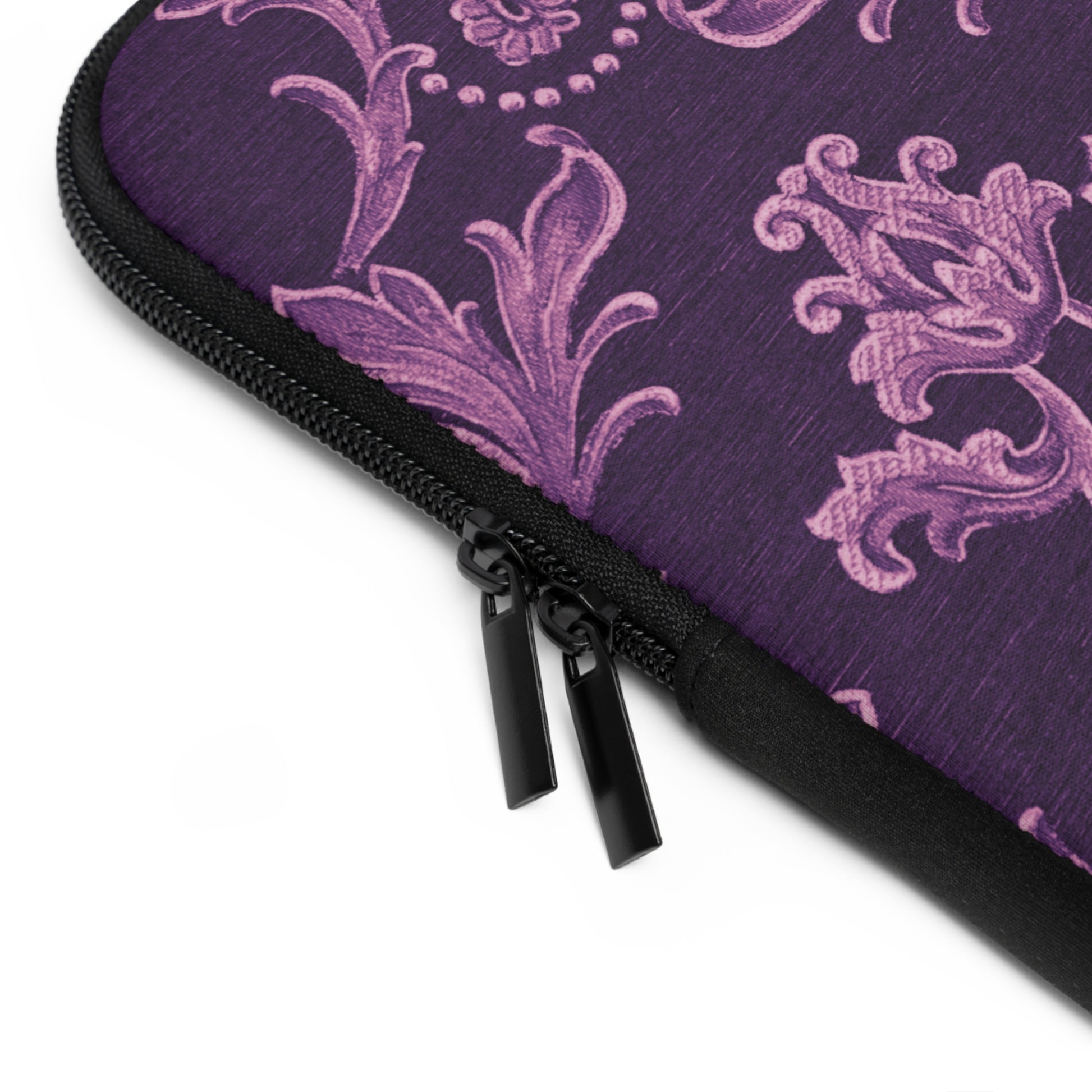 Purple patterned pouch with a black zipper on a white background