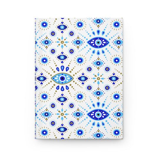 Notebook with blue and gold eye pattern on a white background