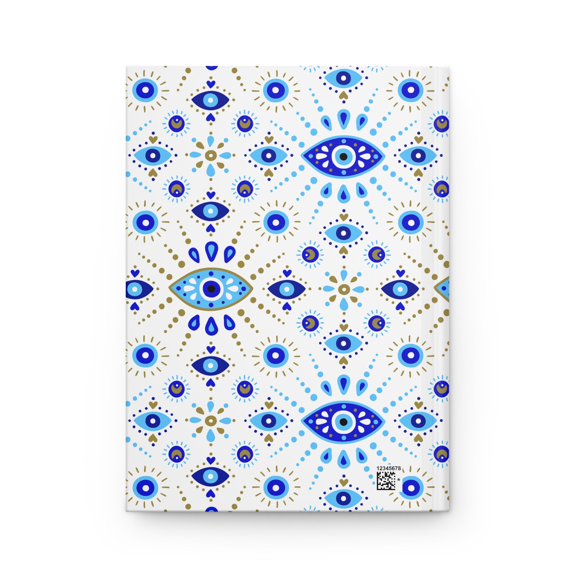 Notebook with blue and gold eye pattern on a white background