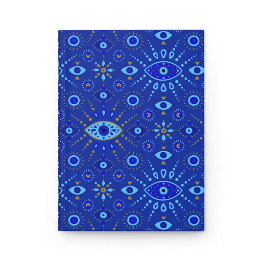 Blue notebook with eye and star pattern on a white background