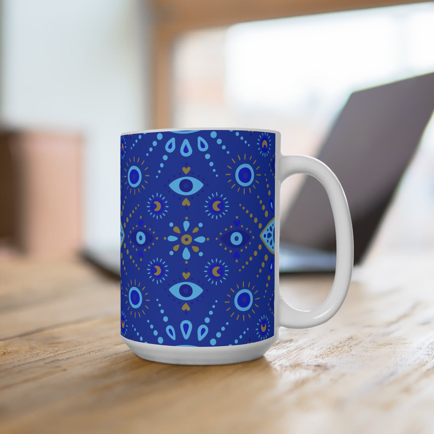 Blue patterned mug on a wooden surface with a blurred background