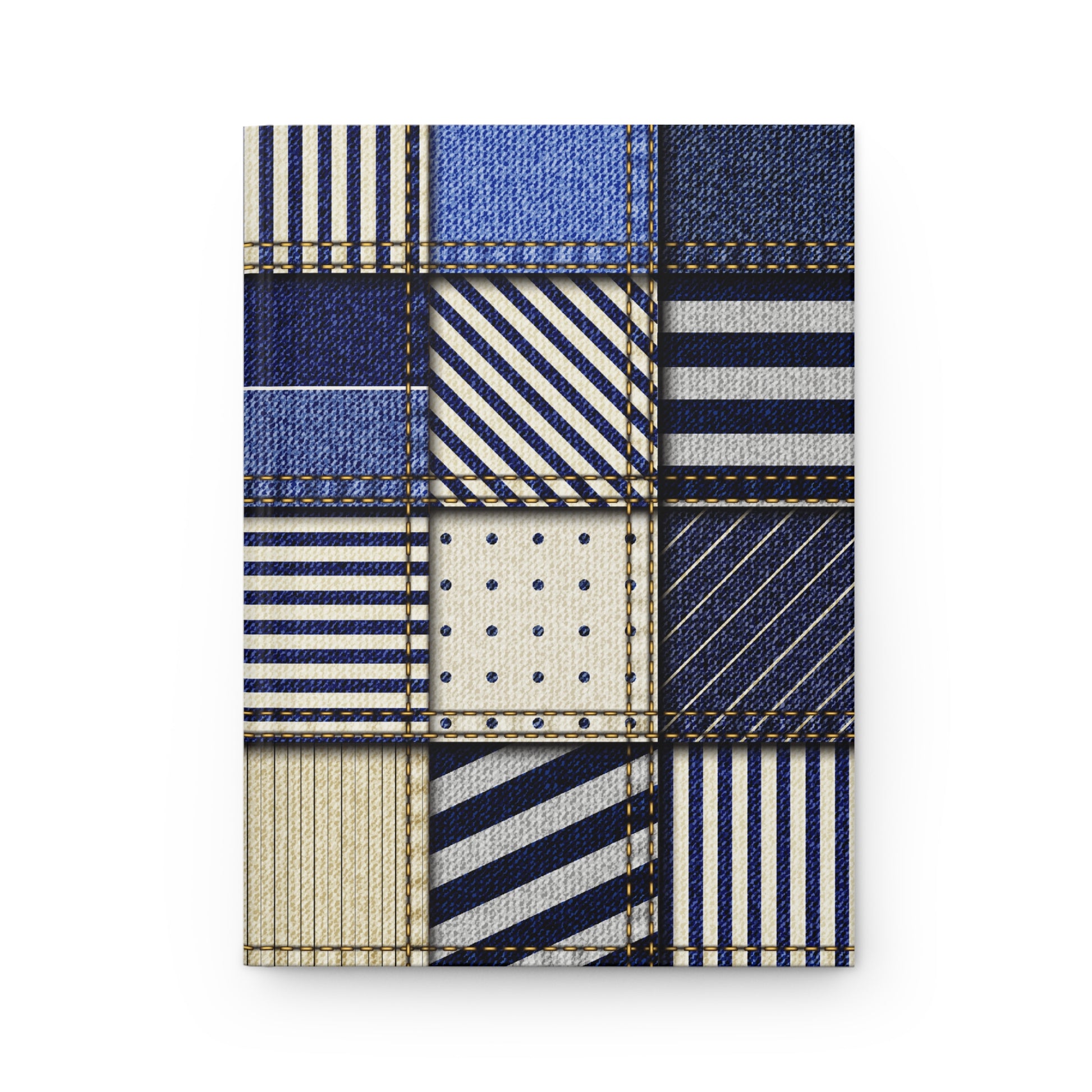 Notebook with patchwork design featuring blue, white, and beige patterns on a white background